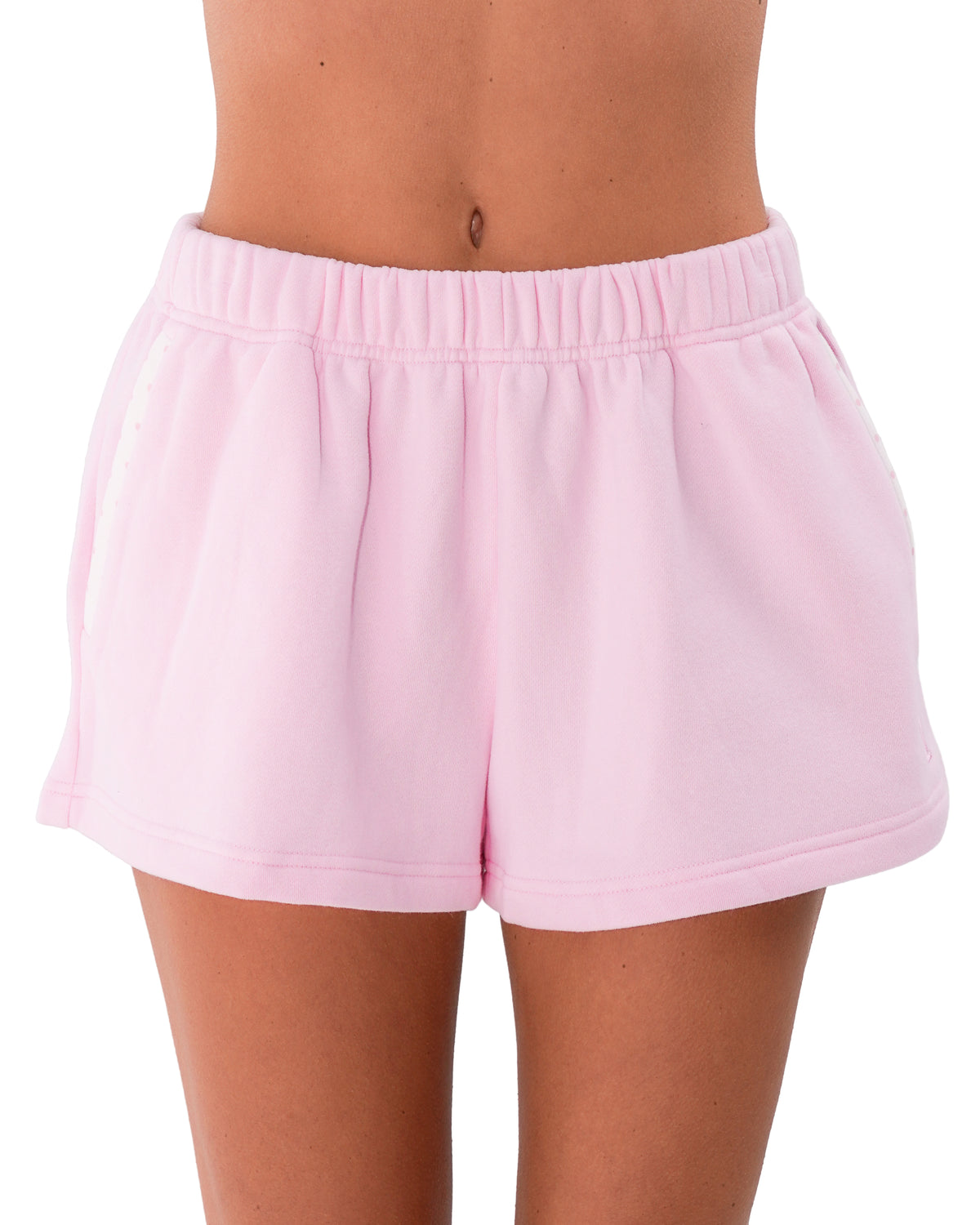 front view of model wearing the lounge short in soft pink and white polka dots