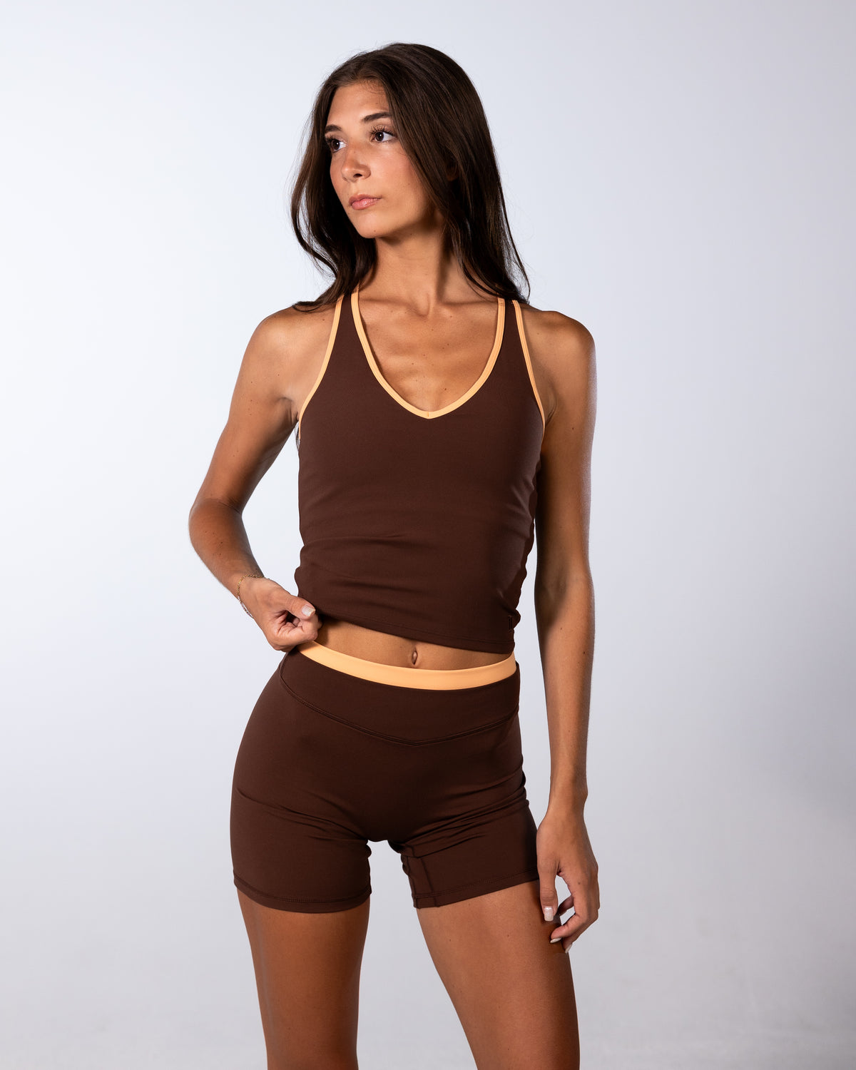 front view of sporty racer tank in mocha brown and apricot